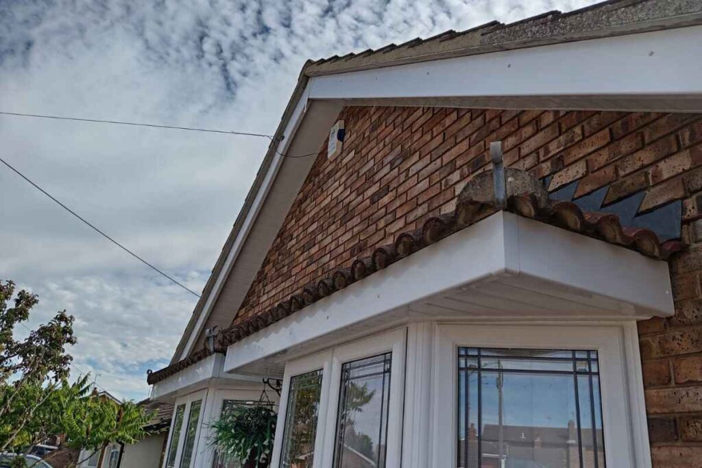 white soffit and fascia boards cleaned on a brick house in Essex